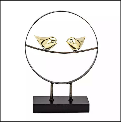 Black And Golden Circular Metal Figurine With A Perched Pair Of Birds Of Size 10L × 3.5W × 14H inch, available exclusively on Shahi Sajawat India, the world of home decor products.Best trendy home decor, living room, kitchen and bathroom decor ideas of 2021.