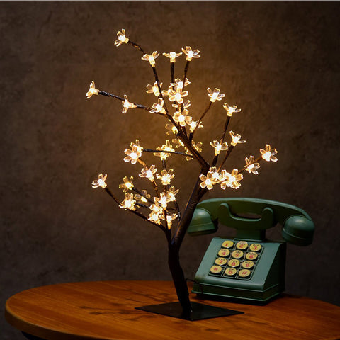 Black PVC + Iron Cherry Tree LED Table Lamp With 48 LED Bulbs (included) With Wedge Base Type, Voltage of 220V and a height of 45cm, available exclusively on Shahi Sajawat India,the world of home decor products.Best trendy home decor, living room and kitchen decor ideas of 2019.