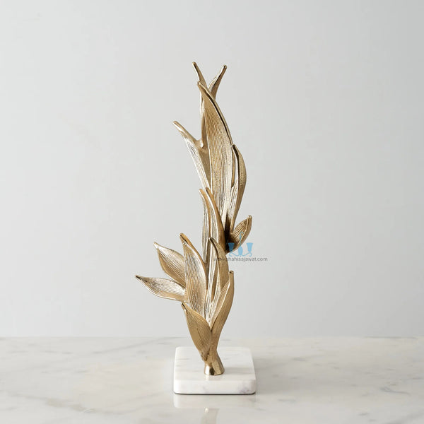 White And Gold Leaf Metal Table Top Handcrafted Sculpture (Figurine), Available exclusively on Shahi Sajawat India, the world of home decor products. Best trendy home decor, office decor, living room,table decor, kitchen and bathroom decor ideas of 2024.