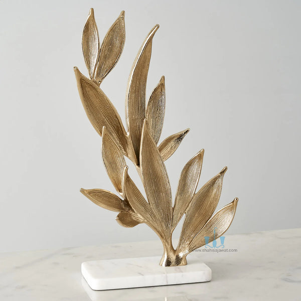 White And Gold Leaf Metal Table Top Handcrafted Sculpture (Figurine), Available exclusively on Shahi Sajawat India, the world of home decor products. Best trendy home decor, office decor, living room,table decor, kitchen and bathroom decor ideas of 2024.