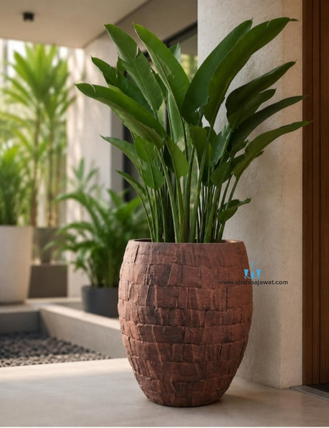 Brown Stone Cladded Finish Vase Shaped FRP (Fiberglass) Indoor And Outdoor Planters Are Lightweight, Durable, Weather Resistant, UV Resistant Made For Residential And Commercial Spaces, Available Exclusively On Shahi Sajawat India, the world of home decor products. Best trendy home decor, office decor, restaurant decor living room, kitchen and bathroom decor ideas of 2026.