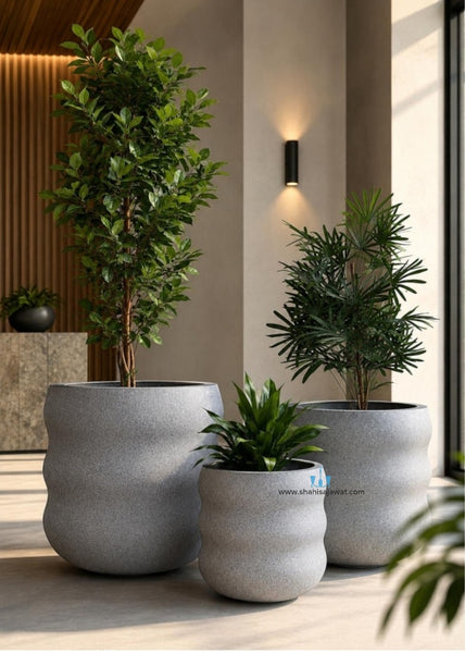 Stone Finished Wavy FRP (Fiberglass) Indoor And Outdoor Planters Are Lightweight, Durable, Weather Resistant, UV Resistant Made For Residential And Commercial Spaces, Available Exclusively On Shahi Sajawat India, the world of home decor products. Best trendy home decor, office decor, restaurant decor, malls, airports, hotels and resort decor ideas of 2026.