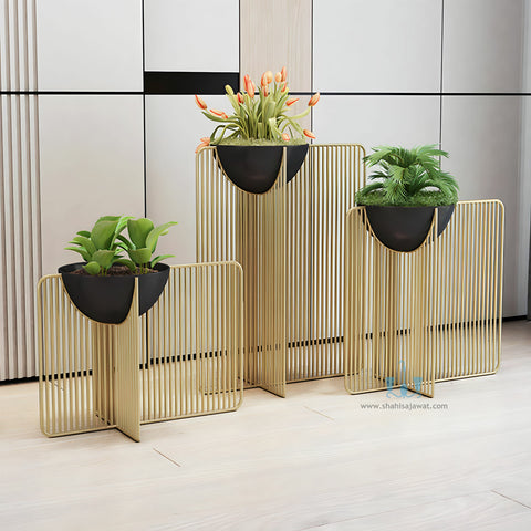 Black/Gold Modern Sleek Handcrafted (Metal) Floor Indoor Planters With Iron Rail Stand And Oval Pot, Available Exclusively On Shahi Sajawat India, the world of home decor products. Best trendy home decor, office decor, restaurant decor living room, kitchen and bathroom decor ideas of 2023.