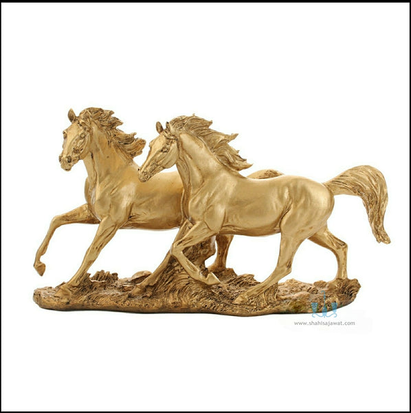 Gold Resin Twin Galloping Horses Tabletop Figurine, Available Exclusively On Shahi Sajawat India, the world of home decor products. Best trendy home decor, office decor, table decor living room, kitchen and bathroom decor ideas of 2023.