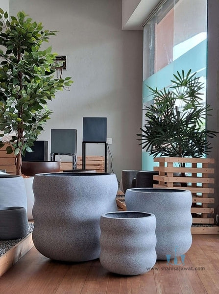 Stone Finished Wavy FRP (Fiberglass) Indoor And Outdoor Planters Are Lightweight, Durable, Weather Resistant, UV Resistant Made For Residential And Commercial Spaces, Available Exclusively On Shahi Sajawat India, the world of home decor products. Best trendy home decor, office decor, restaurant decor, malls, airports, hotels and resort decor ideas of 2026.