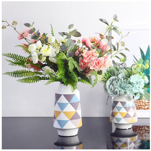 White Multicoloured Geometric Printed Tabletop Ceramic Vase With Anti-slip Mats at Bottom in Large And Medium,available exclusively on Shahi Sajawat India,the world of home decor products.Best trendy home decor, living room and kitchen decor ideas of 2019.