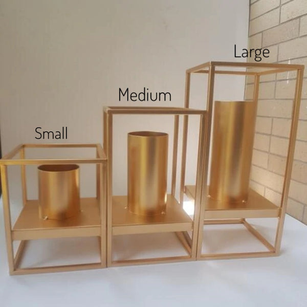 Gold Metal Vases In The Form Of Rack And Cylindrical Vase That Are Non Separable, In Large, Medium And Small Size, available exclusively on Shahi Sajawat India, the world of home decor products.Best trendy home decor, living room, kitchen and bathroom decor ideas of 2021.