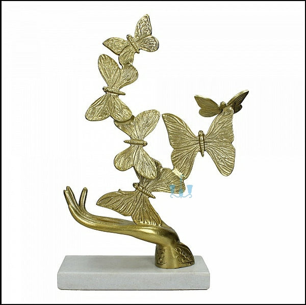 Gold Rising Butterfly From Open Hands Metal Table Top Handcrafted Sculpture (Figurine), Available exclusively on Shahi Sajawat India, the world of home decor products. Best trendy home decor, office decor, living room,table decor, kitchen and bathroom decor ideas of 2022.