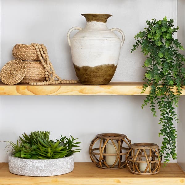 Off-White And Brown Double Handle Metal Tabletop Vase In Size 12.25×10×8.5 inch available exclusively on Shahi Sajawat India, the world of home decor products.Best trendy home decor, living room, kitchen and bathroom decor ideas of 2022.