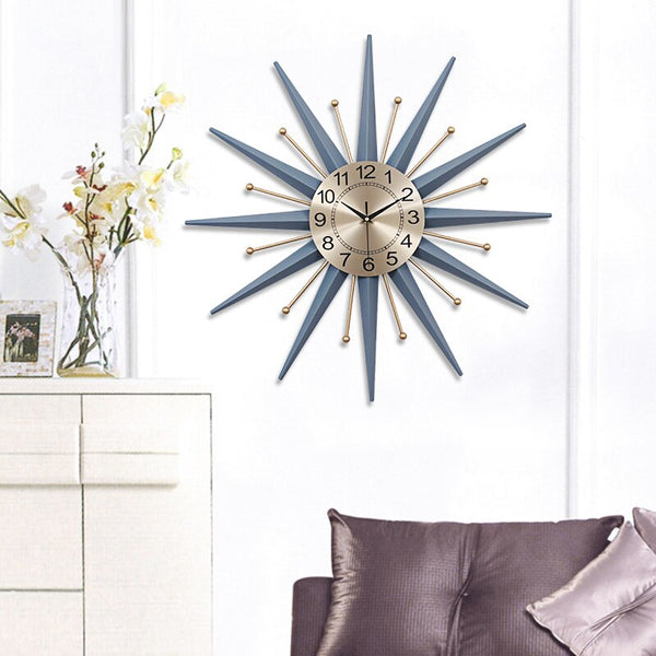 Bluish Grey Geometric Sunburst Metal Quartz Wall Clock Has A Needle Display Type, Single Face Form, In Two Sizes Of 50cm and 70cm, available exclusively on Shahi Sajawat India, the world of home decor products.Best trendy home decor, living room and kitchen decor ideas of 2020.
