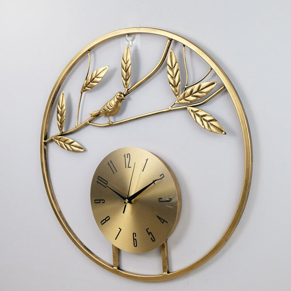 Silver/Gold Circular Bird On Branch Quartz Metal (Wrought Iron) Wall Clocks Of Size 50×50cm, With Single Face Form And Needle Display, available exclusively on Shahi Sajawat India, the world of home decor products.Best trendy home decor, living room, kitchen and bathroom decor ideas of 2022.