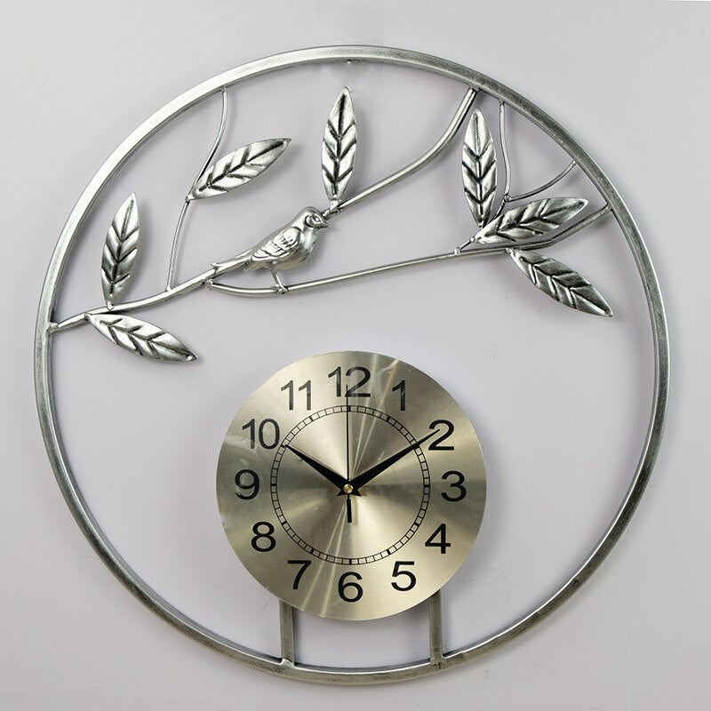 Silver/Gold Circular Bird On Branch Quartz Metal (Wrought Iron) Wall Clocks Of Size 50×50cm, With Single Face Form And Needle Display, available exclusively on Shahi Sajawat India, the world of home decor products.Best trendy home decor, living room, kitchen and bathroom decor ideas of 2022.