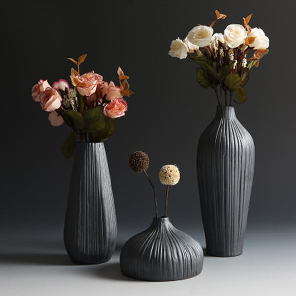 Black Textured Ceramic Vases In 3 Different Size And Shapes,Style 1 ( 11×7.5cm ), Style 2 ( 23×8.7cm ), Style 3 ( 17.4×7.7cm ),available exclusively on Shahi Sajawat India,the world of home decor products.Best trendy home decor and living room decor ideas of 2019.