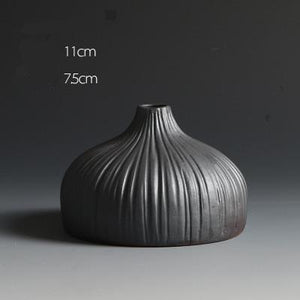 Black Textured Ceramic Vases In 3 Different Size And Shapes,Style 1 ( 11×7.5cm ), Style 2 ( 23×8.7cm ), Style 3 ( 17.4×7.7cm ),available exclusively on Shahi Sajawat India,the world of home decor products.Best trendy home decor and living room decor ideas of 2019.