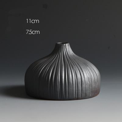 Black Textured Ceramic Vases In 3 Different Size And Shapes,Style 1 ( 11×7.5cm ), Style 2 ( 23×8.7cm ), Style 3 ( 17.4×7.7cm ),available exclusively on Shahi Sajawat India,the world of home decor products.Best trendy home decor and living room decor ideas of 2019.