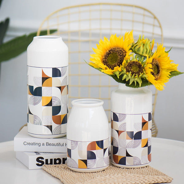 White Geometric Printed Ceramic Tabletop Vases Of Size Large (29*12.5*7.5cm), Medium (23.5*12*6.5CM), and Small (19.5*12.5*8cm), available exclusively on Shahi Sajawat india, the world of home decor products.Best trendy home decor, living room and kitchen decor ideas of 2019.