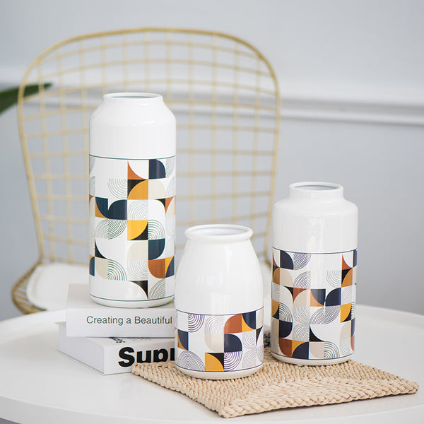 White Geometric Printed Ceramic Tabletop Vases Of Size Large (29*12.5*7.5cm), Medium (23.5*12*6.5CM), and Small (19.5*12.5*8cm), available exclusively on Shahi Sajawat india, the world of home decor products.Best trendy home decor, living room and kitchen decor ideas of 2019.