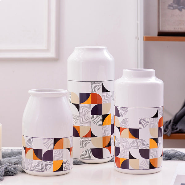 White Geometric Printed Ceramic Tabletop Vases Of Size Large (29*12.5*7.5cm), Medium (23.5*12*6.5CM), and Small (19.5*12.5*8cm), available exclusively on Shahi Sajawat india, the world of home decor products.Best trendy home decor, living room and kitchen decor ideas of 2019.