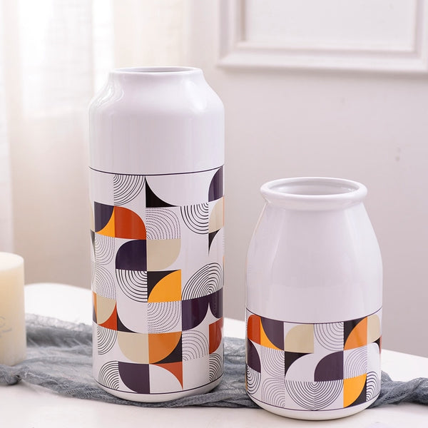 White Geometric Printed Ceramic Tabletop Vases Of Size Large (29*12.5*7.5cm), Medium (23.5*12*6.5CM), and Small (19.5*12.5*8cm), available exclusively on Shahi Sajawat india, the world of home decor products.Best trendy home decor, living room and kitchen decor ideas of 2019.