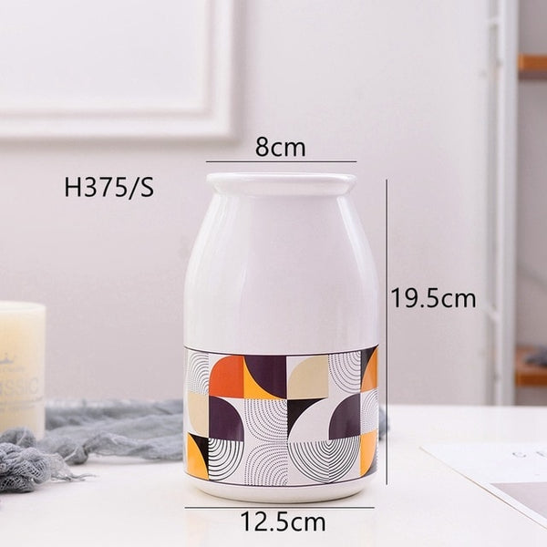 White Geometric Printed Ceramic Tabletop Vases Of Size Large (29*12.5*7.5cm), Medium (23.5*12*6.5CM), and Small (19.5*12.5*8cm), available exclusively on Shahi Sajawat india, the world of home decor products.Best trendy home decor, living room and kitchen decor ideas of 2019.