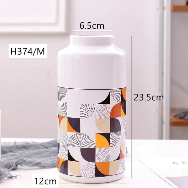 White Geometric Printed Ceramic Tabletop Vases Of Size Large (29*12.5*7.5cm), Medium (23.5*12*6.5CM), and Small (19.5*12.5*8cm), available exclusively on Shahi Sajawat india, the world of home decor products.Best trendy home decor, living room and kitchen decor ideas of 2019.