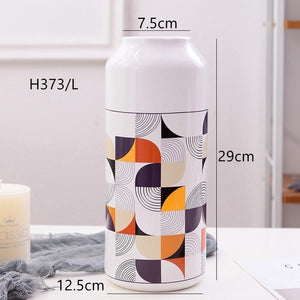 White Geometric Printed Ceramic Tabletop Vases Of Size Large (29*12.5*7.5cm), Medium (23.5*12*6.5CM), and Small (19.5*12.5*8cm), available exclusively on Shahi Sajawat india, the world of home decor products.Best trendy home decor, living room and kitchen decor ideas of 2019.