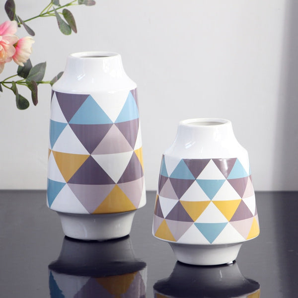 White Multicoloured Geometric Printed Tabletop Ceramic Vase With Anti-slip Mats at Bottom in Large And Medium,available exclusively on Shahi Sajawat India,the world of home decor products.Best trendy home decor, living room and kitchen decor ideas of 2019.