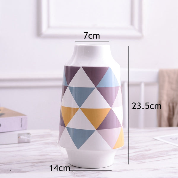 White Multicoloured Geometric Printed Tabletop Ceramic Vase With Anti-slip Mats at Bottom in Large And Medium,available exclusively on Shahi Sajawat India,the world of home decor products.Best trendy home decor, living room and kitchen decor ideas of 2019.
