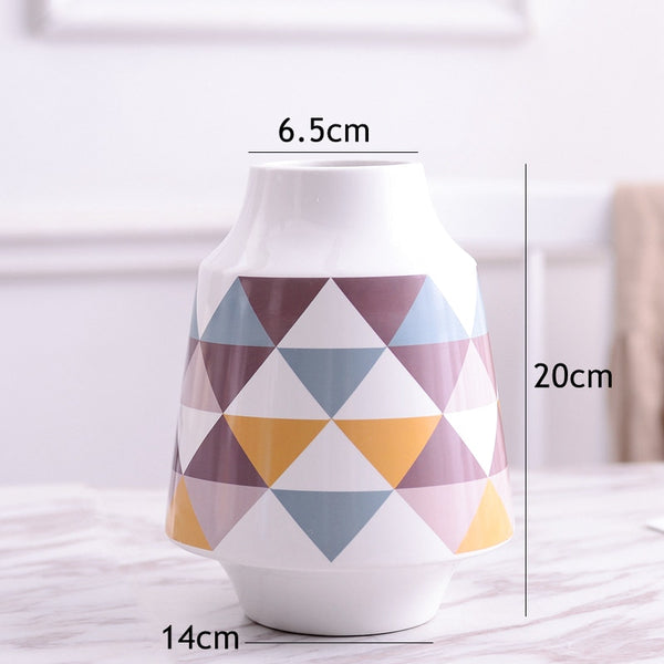 White Multicoloured Geometric Printed Tabletop Ceramic Vase With Anti-slip Mats at Bottom in Large And Medium,available exclusively on Shahi Sajawat India,the world of home decor products.Best trendy home decor, living room and kitchen decor ideas of 2019.