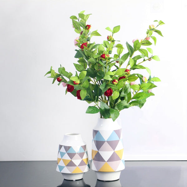 White Multicoloured Geometric Printed Tabletop Ceramic Vase With Anti-slip Mats at Bottom in Large And Medium,available exclusively on Shahi Sajawat India,the world of home decor products.Best trendy home decor, living room and kitchen decor ideas of 2019.