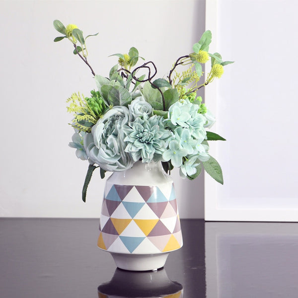 White Multicoloured Geometric Printed Tabletop Ceramic Vase With Anti-slip Mats at Bottom in Large And Medium,available exclusively on Shahi Sajawat India,the world of home decor products.Best trendy home decor, living room and kitchen decor ideas of 2019.