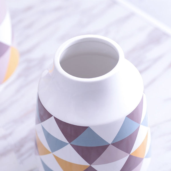White Multicoloured Geometric Printed Tabletop Ceramic Vase With Anti-slip Mats at Bottom in Large And Medium,available exclusively on Shahi Sajawat India,the world of home decor products.Best trendy home decor, living room and kitchen decor ideas of 2019.