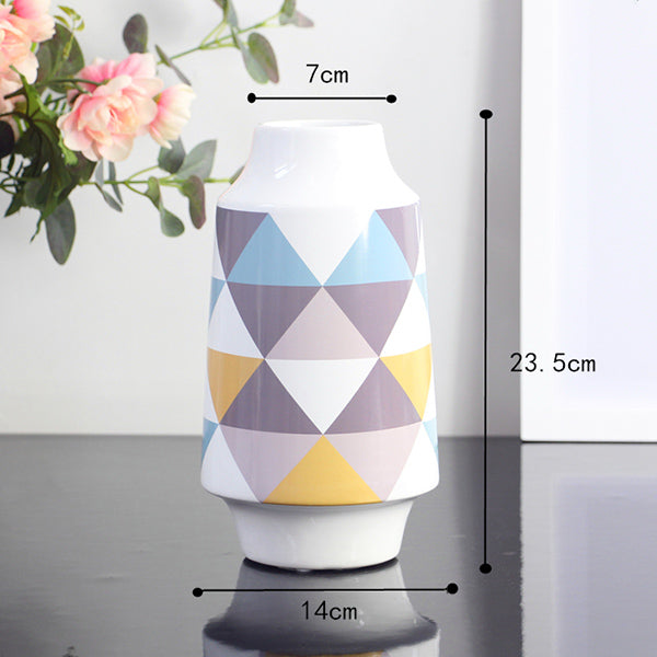 White Multicoloured Geometric Printed Tabletop Ceramic Vase With Anti-slip Mats at Bottom in Large And Medium,available exclusively on Shahi Sajawat India,the world of home decor products.Best trendy home decor, living room and kitchen decor ideas of 2019.