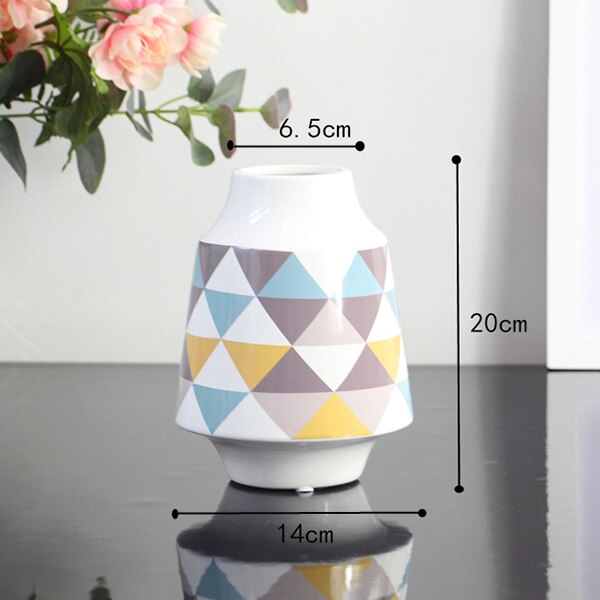 White Multicoloured Geometric Printed Tabletop Ceramic Vase With Anti-slip Mats at Bottom in Large And Medium,available exclusively on Shahi Sajawat India,the world of home decor products.Best trendy home decor, living room and kitchen decor ideas of 2019.